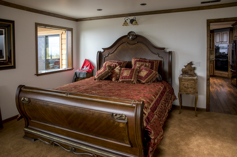 A sleigh bed in the bedroom.