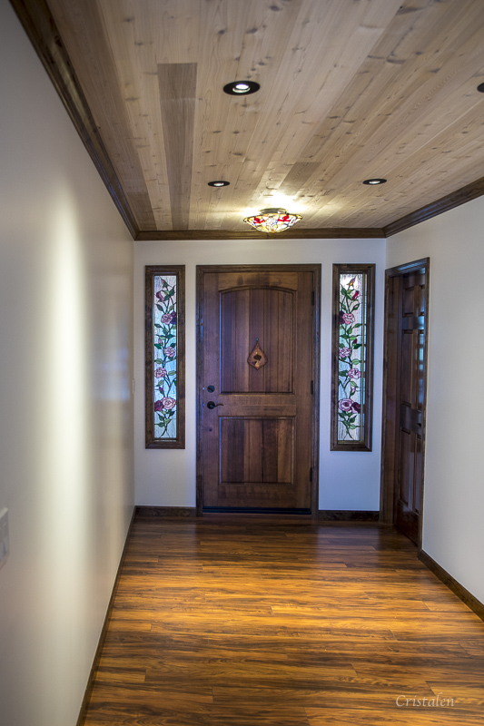 The inside of the entry hall into the home showing the front door.