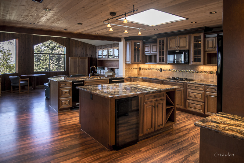 A kitchen with two islands and a counter.