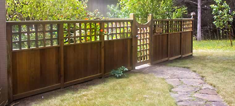 Exterior of a fence with walkway and gate.