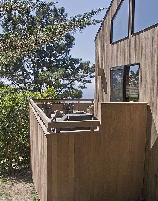 The exterior of the home showing the finished deck.